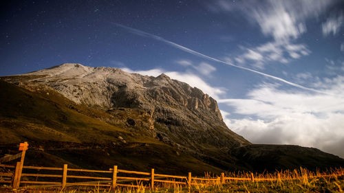 Scenic view of mountains against sky at night