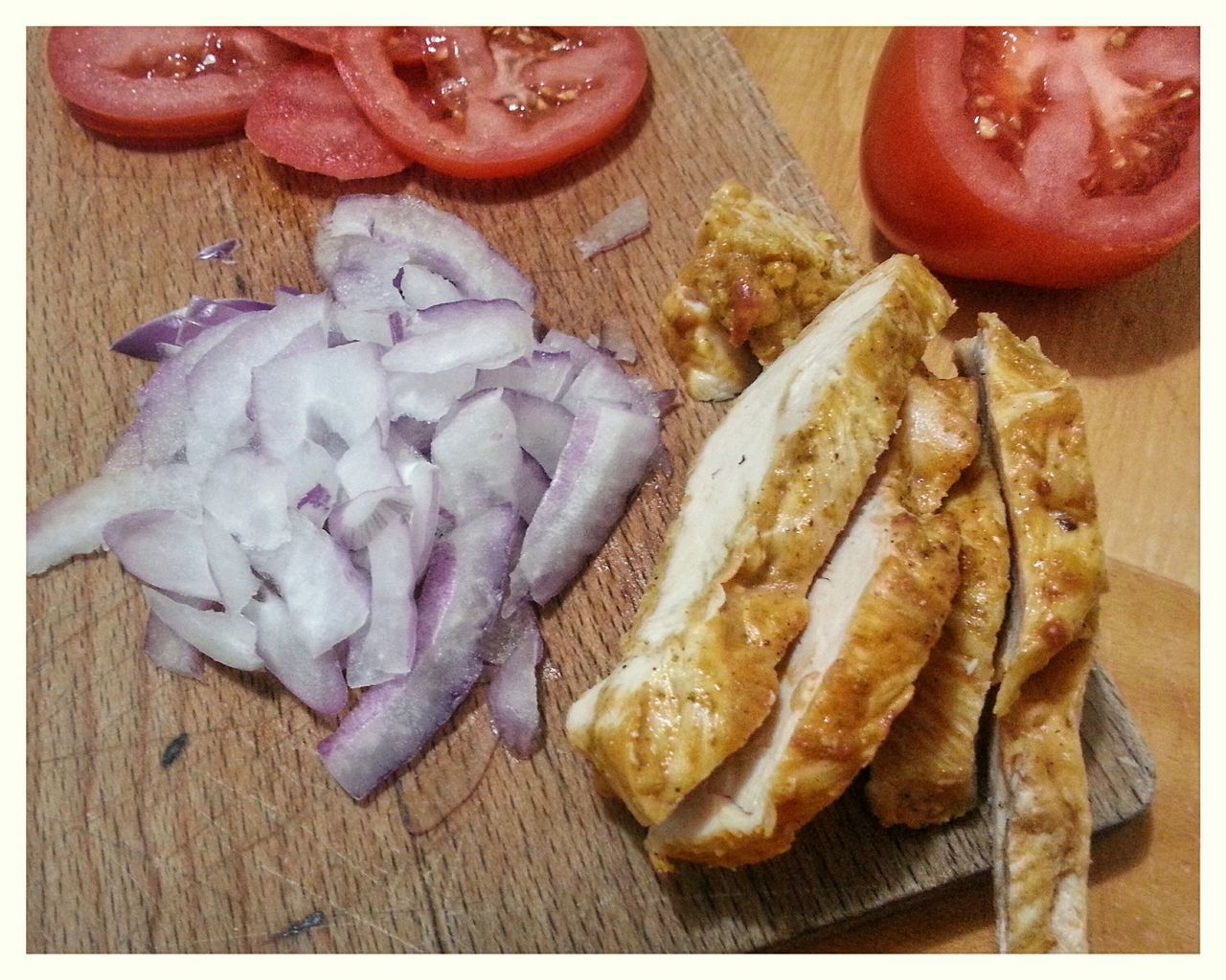 CLOSE-UP OF MEAT AND VEGETABLES ON TABLE