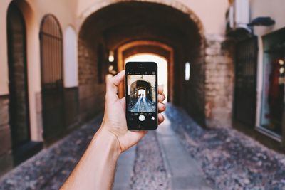 Person photographing through camera