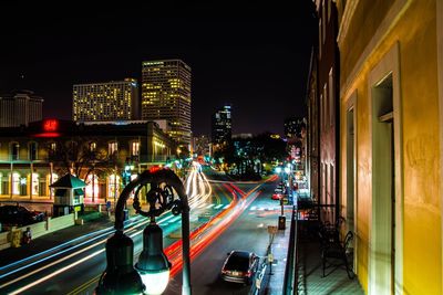 Light trails on road in city at night