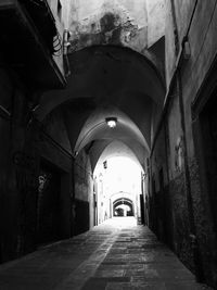 Empty corridor along buildings