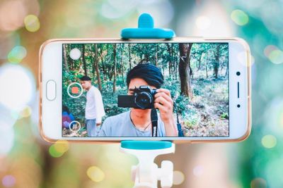 Portrait of man photographing