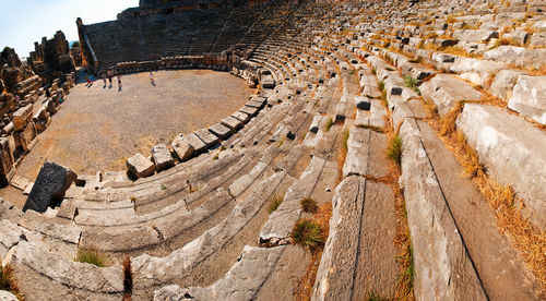 Tourists visiting ancient amphitheater