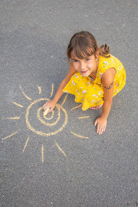 Boy playing with chalk