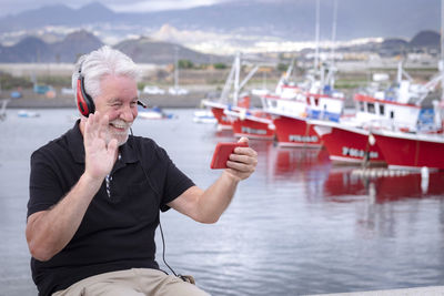 Man sitting on boat in water