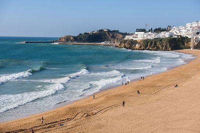 Scenic view of beach against clear sky