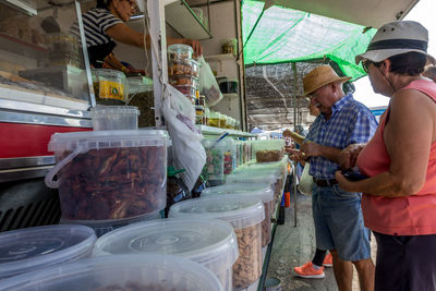 People standing at market stall