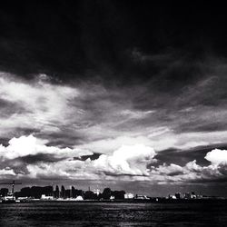 Scenic view of sea against cloudy sky