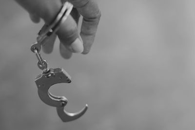 Close-up of person holding cigarette