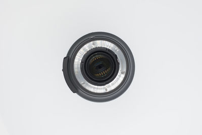 Close-up of camera against white background