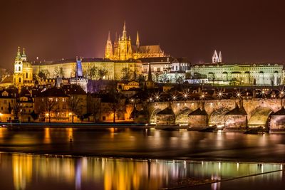 Reflection of illuminated buildings in water at night