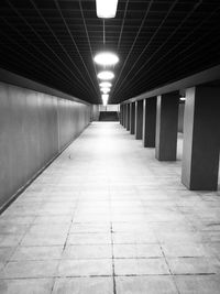 Empty illuminated corridor in building