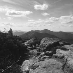 Scenic view of mountains against cloudy sky