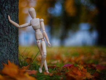 Full length of boy figurine on field during autumn