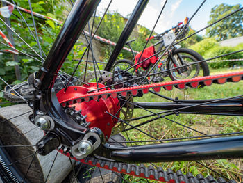 Close-up of bicycle wheel on field