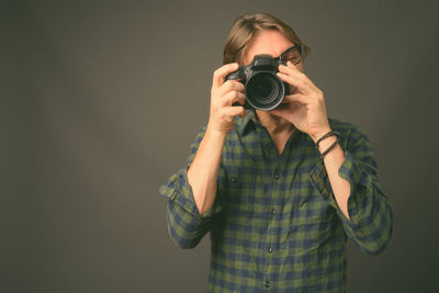 Portrait of man photographing