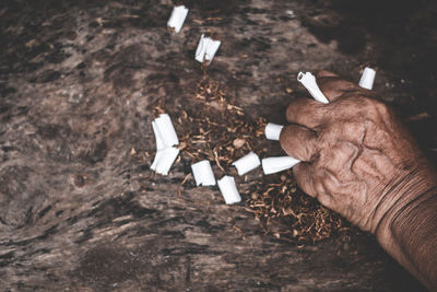 High angle view of man smoking cigarette