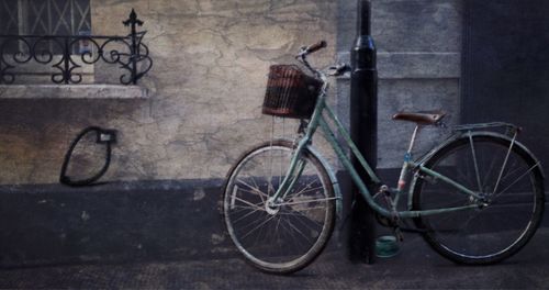 Bicycle parked against wall
