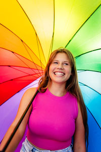 Portrait of young woman with umbrella