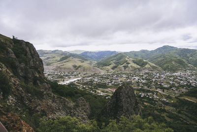 Scenic view of landscape and mountains against sky