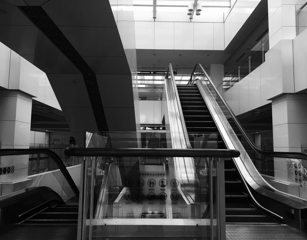 steps and staircases, staircase, steps, railing, architecture, built structure, escalator, stairs, indoors, modern, hand rail, no people, day