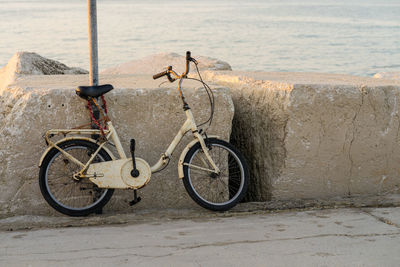 Bicycle leaning on wall