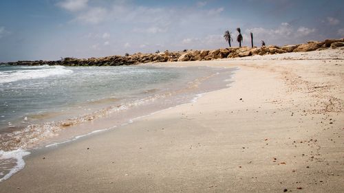 Scenic view of beach against sky