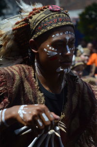 Portrait of man wearing mask on street