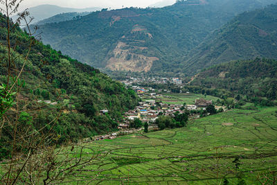 Village situated at the foothills of the mountain with paddy fields
