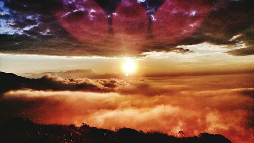 Scenic view of dramatic sky during sunset