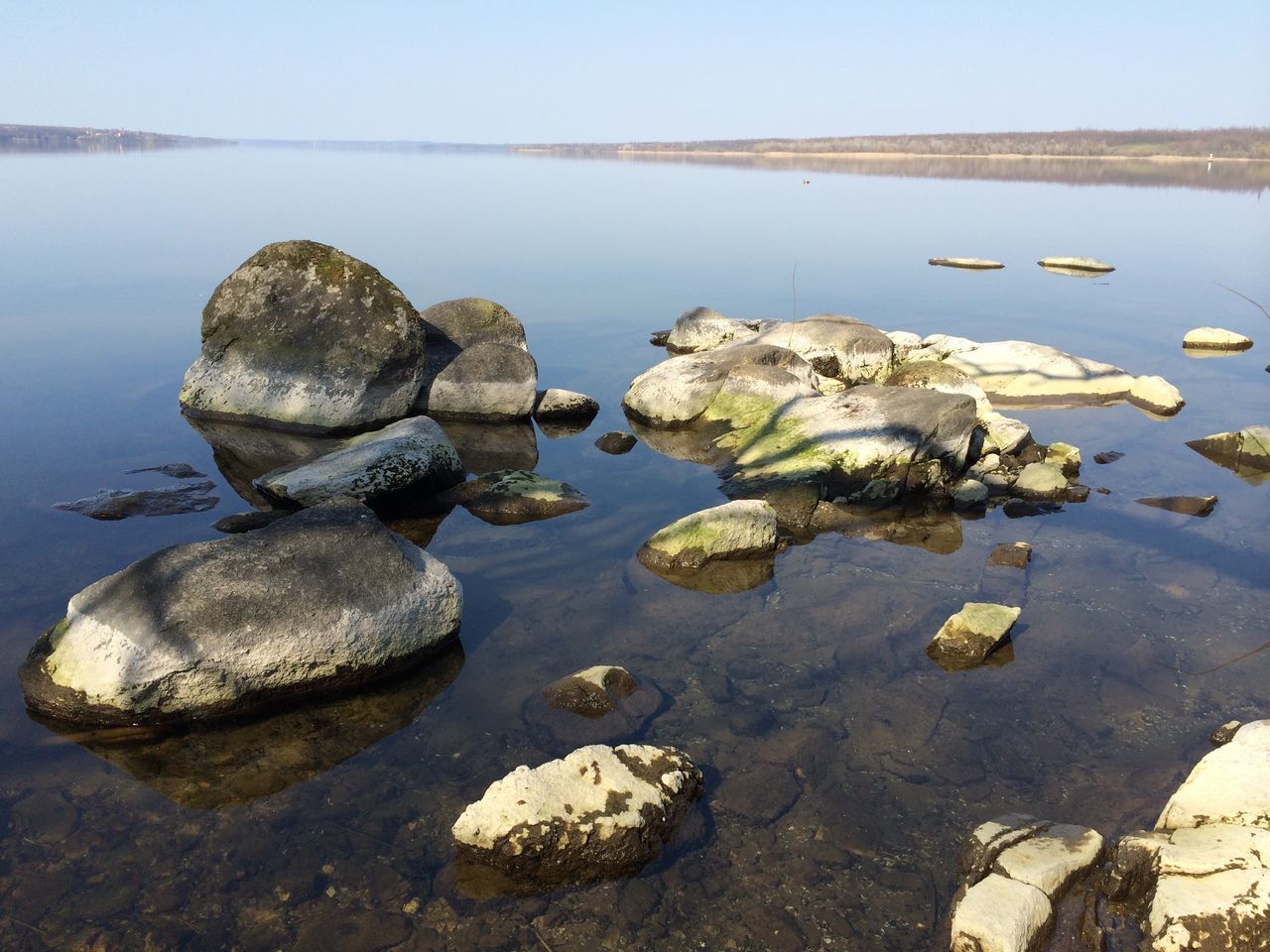 water, rock - object, tranquility, tranquil scene, sea, reflection, nature, stone - object, stone, rock, scenics, lake, nautical vessel, transportation, beauty in nature, day, clear sky, calm, outdoors, boat