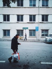 Man with woman standing on street