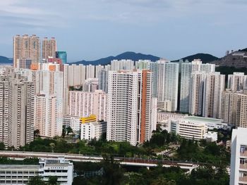 Buildings in city against sky