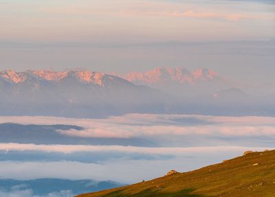 Scenic view of mountains against sky during sunset