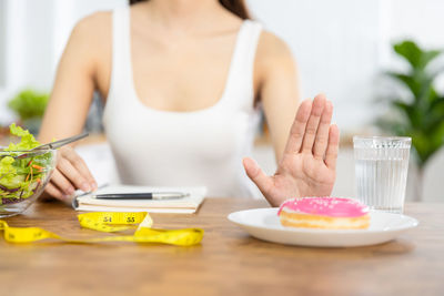 Midsection of woman preparing food