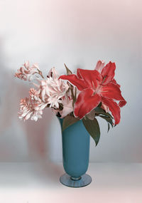 Close-up of red flower vase on table