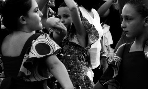 Close-up of people dancing in traditional clothing