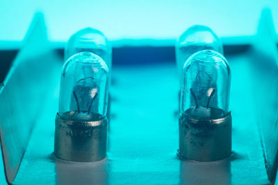 Close-up of blue drinking glass on table