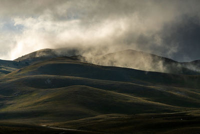 Scenic view of volcanic mountain against sky