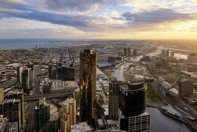 High angle view of cityscape against cloudy sky