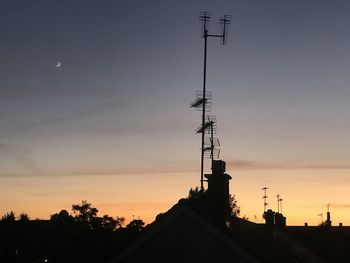 Silhouette of building against sky during sunset