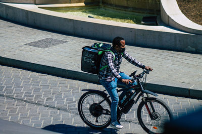 Man riding bicycle in city