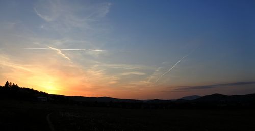 Scenic view of silhouette landscape against sky during sunset