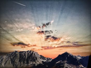 Panoramic view of mountain range against sky during sunset