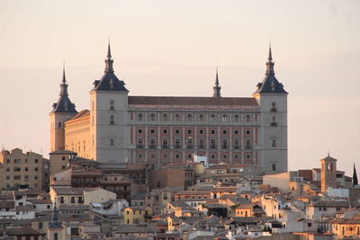 View of buildings in city against sky