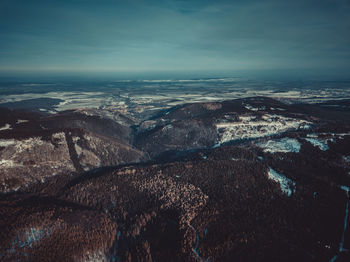 Aerial view of landscape and sea against sky