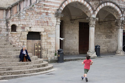 People walking in historic building