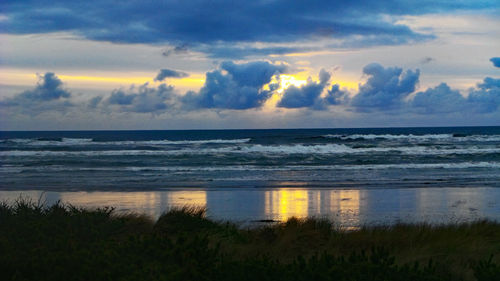 Scenic view of sea at sunset