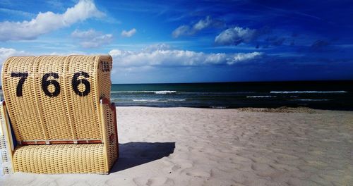 Scenic view of beach against blue sky