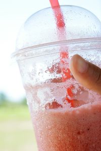 Close-up of hand holding drink